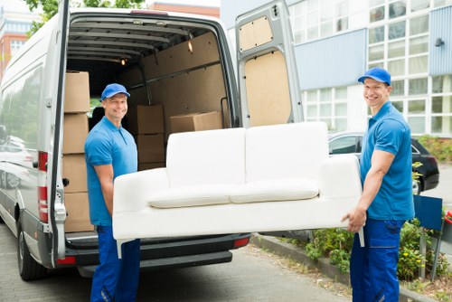 People organizing belongings in an Ardleighgreen storage space