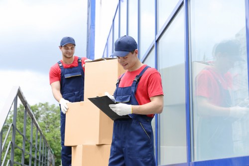 Professional movers loading furniture for a local relocation